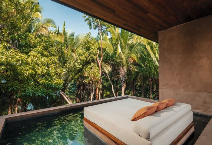 One&Only Mandarina gay-friendly hotel suite. Daybed by a plunge pool overlooking lush jungle. Luxury gay travel in Riviera Nayarit, Mexico.