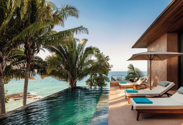 One&Only Mandarina gay-friendly hotel. Infinity pool, ocean view, lounge chairs. Tropical luxury for gay travel. Gay resort vacation.