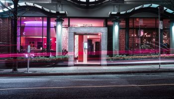 Opus Hotel entrance at night. This gay-friendly hotel features modern design and is located in Vancouver. A great choice for gay travelers.