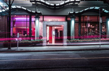 Opus Hotel entrance at night. This gay-friendly hotel features modern design and is located in Vancouver. A great choice for gay travelers.