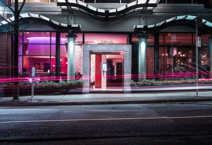 Opus Hotel entrance at night. This gay-friendly hotel features modern design and is located in Vancouver. A great choice for gay travelers.