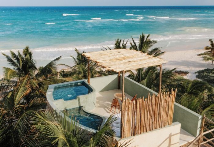 Orchid Beach House Adults Only: Rooftop view of a gay-friendly hotel with pools, beach, and ocean. Tropical paradise for gay men's travel.