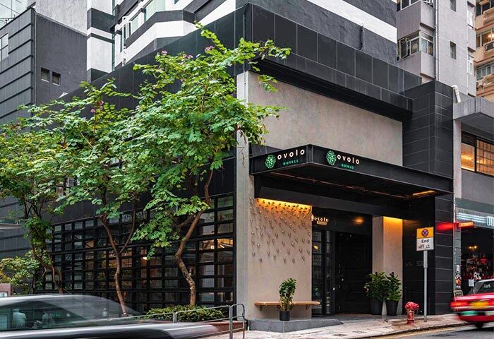 Ovolo Central Hotel exterior. Gay-friendly hotel in Hong Kong with modern design. Urban setting, street view, and stylish facade.