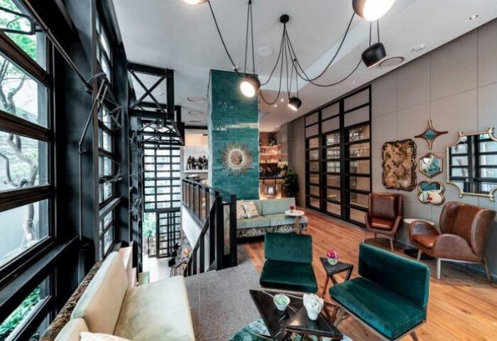 Ovolo Central gay-friendly hotel interior. Modern design, stylish seating area. Great for gay men travel. Hong Kong hotel.