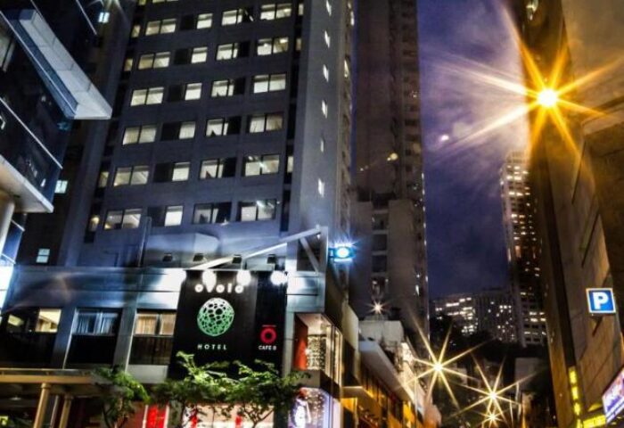 Ovolo Central gay-friendly hotel exterior at night. Urban setting with street lights. Modern architecture in Hong Kong, a top destination for gay men.