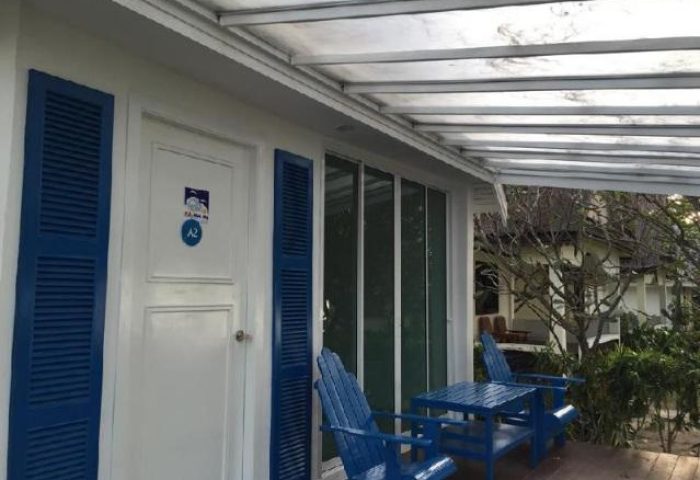 P.P. Blue Sky Resort's room with a blue table and chairs on the porch. Gay-friendly hotel with a relaxing atmosphere for gay travelers.