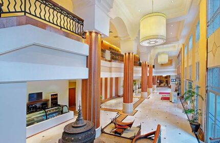 PARKROYAL Yangon Hotel's grand lobby. This gay-friendly hotel features soaring ceilings, marble floors, and elegant decor, perfect for gay travelers.