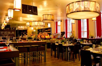 PLUS Berlin Hotel & Hostel's restaurant. Gay-friendly hotel with modern decor, stylish lighting, and a well-stocked bar. Ideal for gay travel.