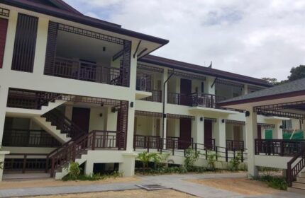 PP Princess Resort exterior. Gay-friendly hotel architecture with balconies, stairs, and tropical plants. Ideal for gay men travel.