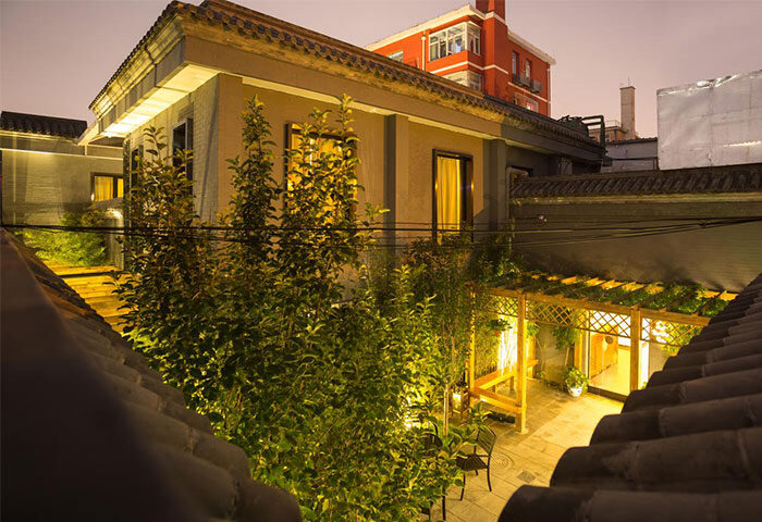 PUREMIND Hutong Courtyard Hotel's gay-friendly charm. Night view of the courtyard, showcasing its serene ambiance for gay travelers.