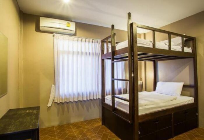 Pak Up Hostel gay-friendly hotel room. Bunk beds, air conditioning, and tiled floor. An affordable option for gay travelers.