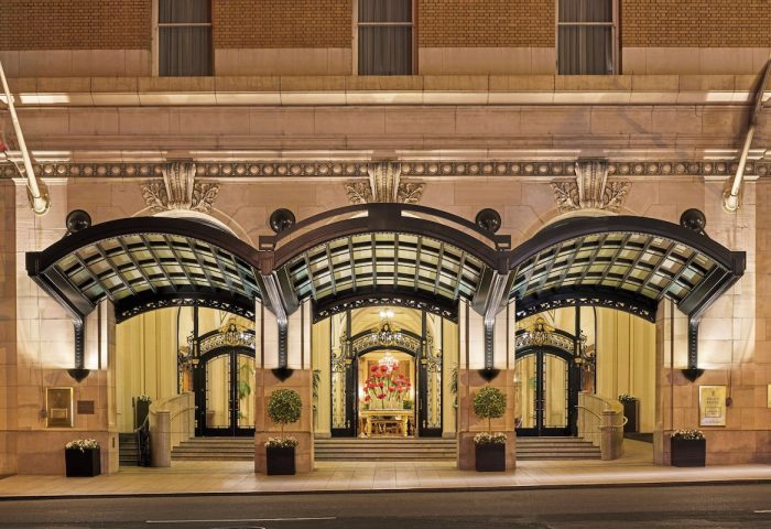 Palace Hotel, a Luxury Collection Hotel, San Francisco entrance. Gay-friendly hotel with ornate doors and glass canopies at night.