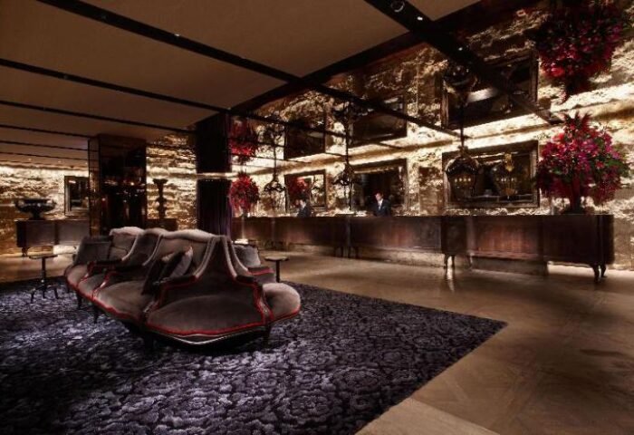 Palais de Chine Hotel's lobby. Gay-friendly hotel with a luxurious lounge area and reception desk. Upscale travel for gay men.