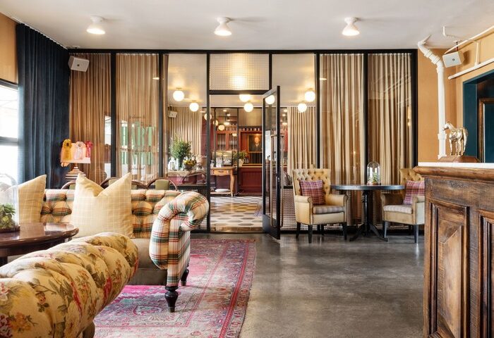 Palihotel Melrose lobby interior. Gay-friendly hotel with stylish decor, cozy seating, and a welcoming atmosphere. Perfect for gay men travel.