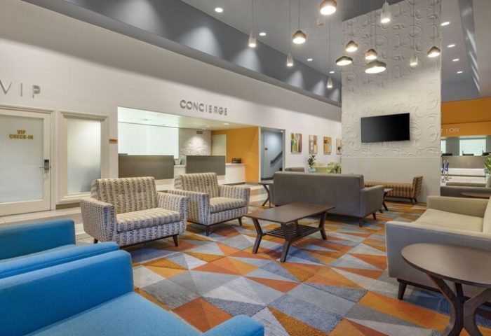 Palm Canyon Resort lobby, a gay-friendly hotel in Palm Springs. Features concierge, seating areas, and modern design. Ideal for gay travel.