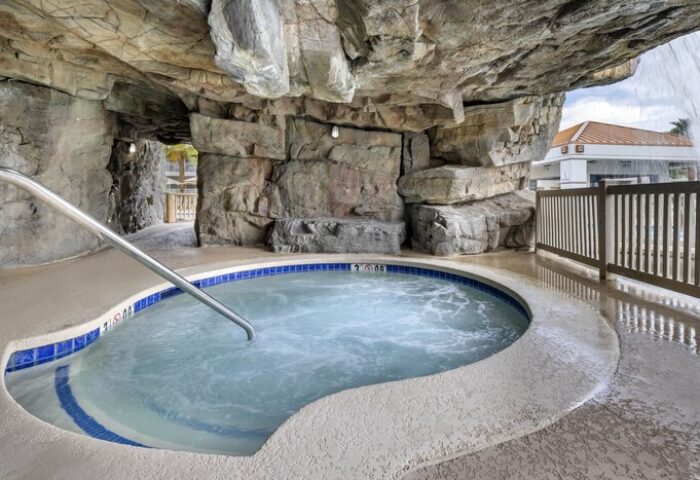 Palm Canyon Resort's gay-friendly hotel hot tub. The Palm Springs Hilton Vacation Club features a rock grotto-style jacuzzi.