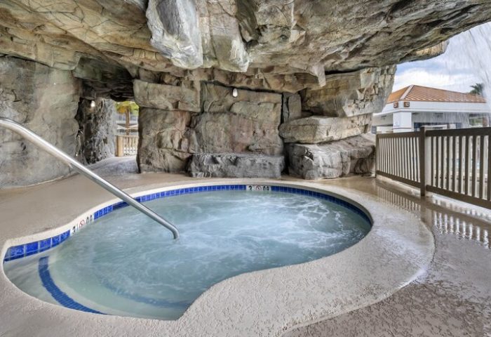 Palm Canyon Resort's gay-friendly hotel hot tub. The Palm Springs Hilton Vacation Club features a rock grotto-style jacuzzi.