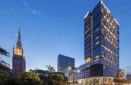 Pan Pacific Yangon, a gay-friendly hotel. Modern skyscraper next to a historic church. A great choice for gay travelers in Yangon.