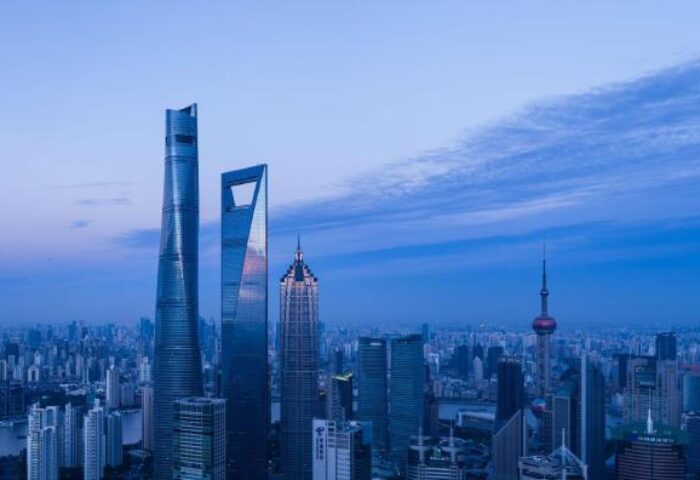 Shanghai skyline at dusk. Gay-friendly hotel Park Hyatt Shanghai offers stunning views of the city's iconic skyscrapers, a must-see for gay travelers.