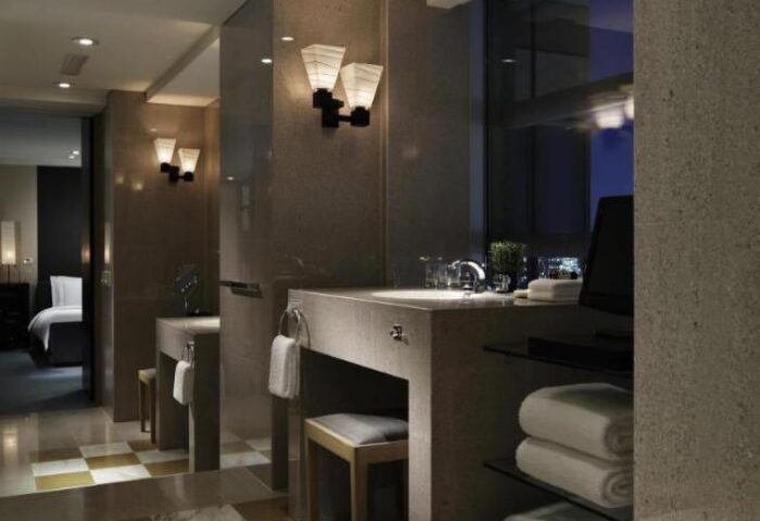 Park Hyatt Tokyo's pet-friendly room. Bathroom interior of this gay-friendly hotel features double sinks, towels, and a view.