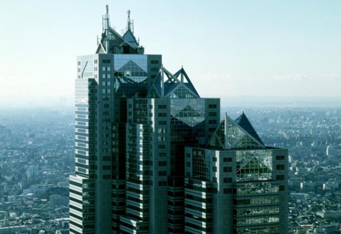 Park Hyatt Tokyo, a gay-friendly & pet-friendly hotel. View of the iconic skyscraper against the Tokyo skyline. Luxury travel for gay men.