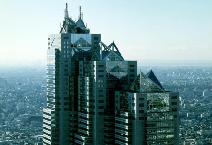 Park Hyatt Tokyo, a gay-friendly & pet-friendly hotel. View of the iconic skyscraper against the Tokyo skyline. Luxury travel for gay men.