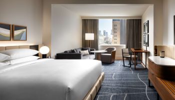 Park Hyatt Toronto hotel room. Modern design, city view, desk, and seating area. Gay-friendly hotel.