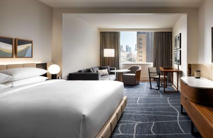 Park Hyatt Toronto hotel room. Modern design, city view, desk, and seating area. Gay-friendly hotel.