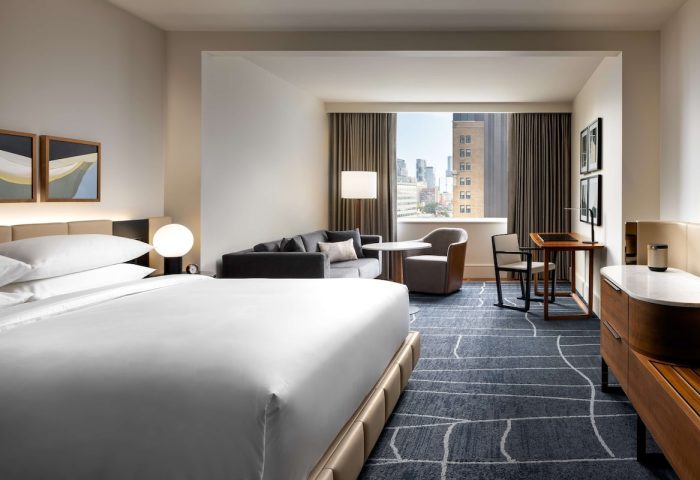 Park Hyatt Toronto hotel room. Modern design, city view, desk, and seating area. Gay-friendly hotel.