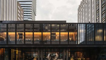 Park Hyatt Toronto, a gay-friendly hotel. Exterior view of the modern building's entrance, showing its sleek design and upscale ambiance.