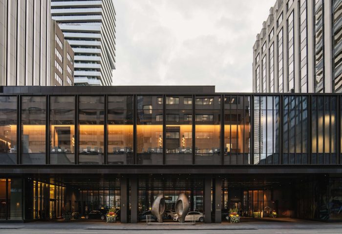 Park Hyatt Toronto, a gay-friendly hotel. Exterior view of the modern building's entrance, showing its sleek design and upscale ambiance.
