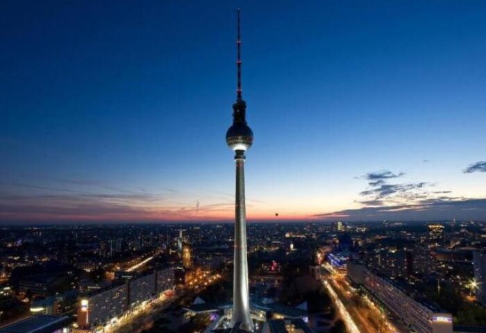 Berlin TV Tower view from Park Inn by Radisson Alexanderplatz, a gay-friendly hotel. Night cityscape for gay travelers.