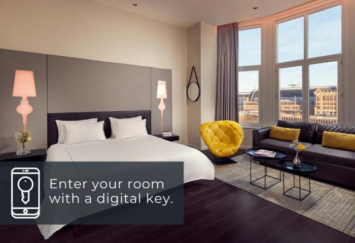 Park Plaza Victoria Amsterdam Hotel room. A gay-friendly hotel with digital key access, bed, sofa, and city view.