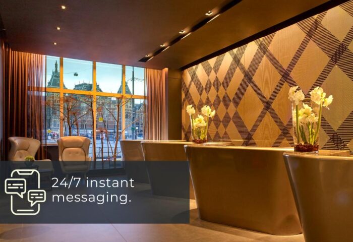 Park Plaza Victoria Amsterdam Hotel lobby. Gay-friendly hotel with modern design, reception desk, and city view. Perfect for gay men travelers.