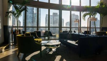 Parker Hotel Vancouver interior. Gay-friendly hotel lounge area with city view. Modern design, seating, and natural light. #gaytravel