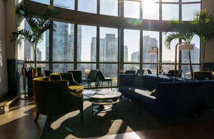 Parker Hotel Vancouver interior. Gay-friendly hotel lounge area with city view. Modern design, seating, and natural light. #gaytravel