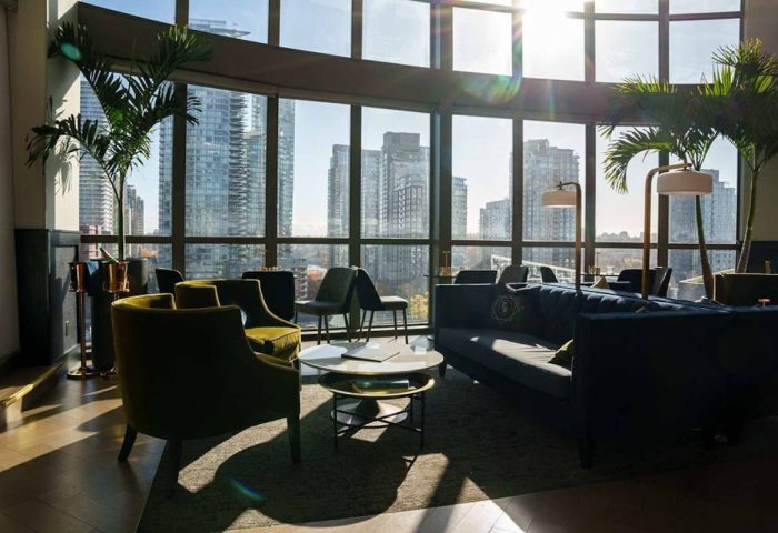 Parker Hotel Vancouver interior. Gay-friendly hotel lounge area with city view. Modern design, seating, and natural light. #gaytravel