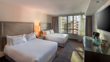 Parker Hotel Vancouver: Gay-friendly hotel room with two beds, city view, and modern amenities. Ideal for gay travelers in Vancouver.