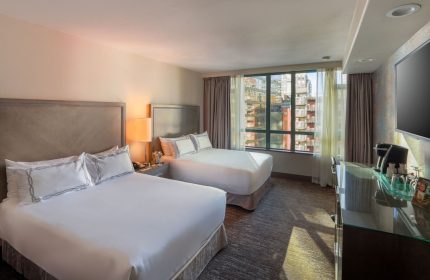 Parker Hotel Vancouver: Gay-friendly hotel room with two beds, city view, and modern amenities. Ideal for gay travelers in Vancouver.