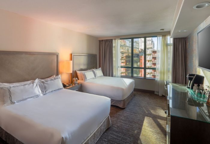 Parker Hotel Vancouver: Gay-friendly hotel room with two beds, city view, and modern amenities. Ideal for gay travelers in Vancouver.