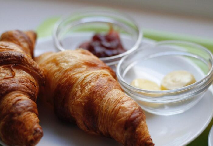 Breakfast at Gay-Friendly Parrots Sitges Hotel. Croissants with butter and jam. Enjoy your stay at this gay hotel in sunny Sitges.