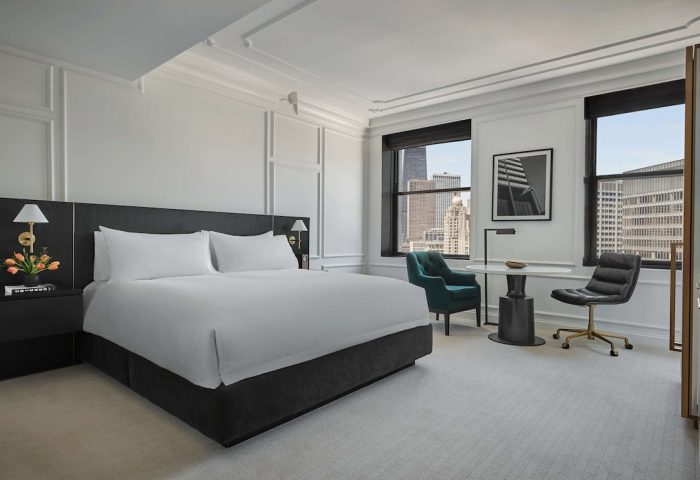 Pendry Chicago gay-friendly hotel room. Modern interior with a king bed, desk, and city views. Upscale lodging for gay travelers.