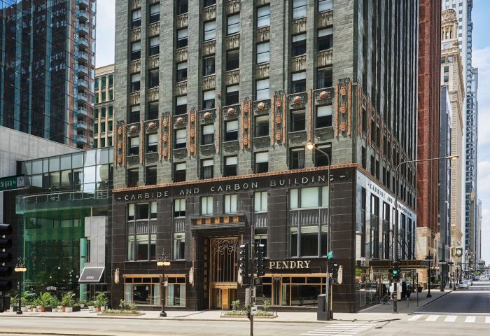 Pendry Chicago, a gay-friendly hotel. The Carbide and Carbon Building's Art Deco facade, a luxury destination for LGBTQ+ travelers.
