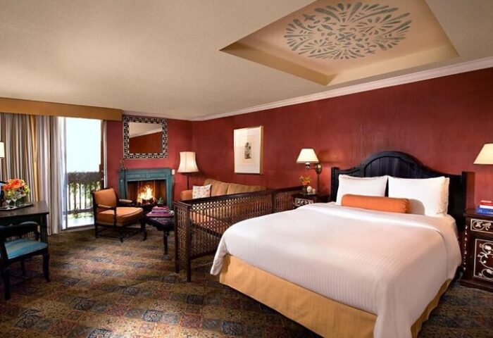 Petit Ermitage Hotel, Adults Only, gay-friendly room. Fireplace, king bed, and balcony. Upscale gay hotel for discerning travelers.