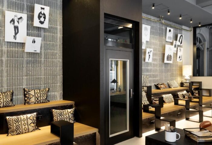 Petit Palace Chueca's stylish lounge area. Gay-friendly hotel with modern decor, art, and comfortable seating. Ideal for gay men travel in Madrid.