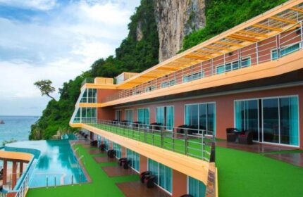 Phi Phi Cliff Beach Resort view. Gay-friendly hotel with pool, rooms, and cliffside setting. Ideal for gay men's travel in Thailand.