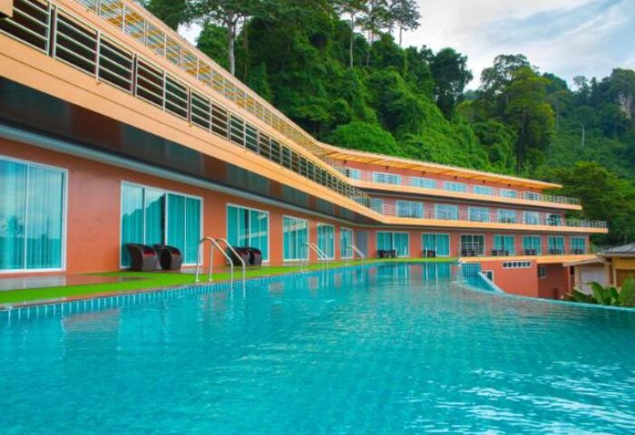 Phi Phi Cliff Beach Resort's pool. Gay-friendly hotel with cliffside views and a large pool. Perfect for gay men's travel in Thailand.