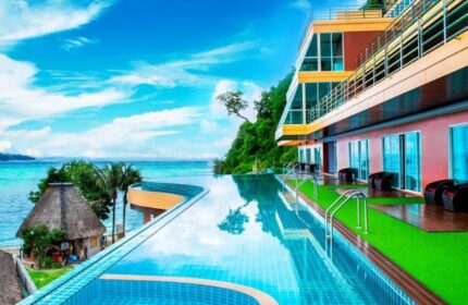 Phi Phi Cliff Beach Resort infinity pool view. Gay-friendly hotel with ocean views. Perfect for gay men's travel in Thailand.