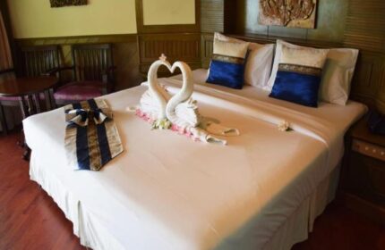 Hotel room at Phi Phi Island Cabana Hotel. Swans made of towels on bed. Gay-friendly hotel in Thailand. Romantic getaway.