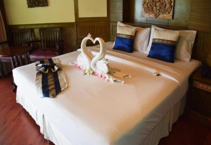 Hotel room at Phi Phi Island Cabana Hotel. Swans made of towels on bed. Gay-friendly hotel in Thailand. Romantic getaway.